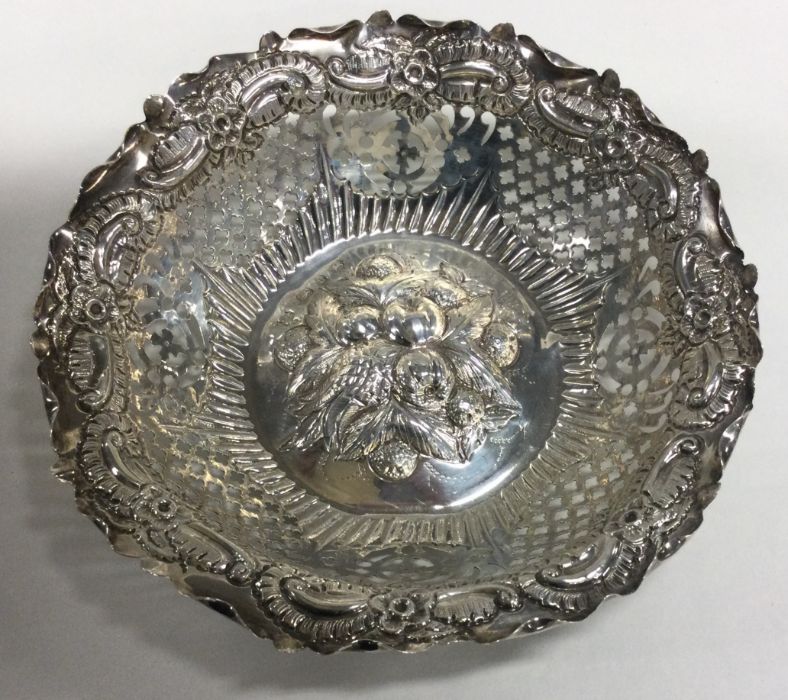 A circular chased silver dish with scroll decorati - Image 2 of 2