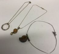 A silver necklace and pendant together with one ot