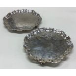 A good pair of shaped circular salvers on scroll f