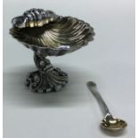 A good cast silver salt in the form of a shell on