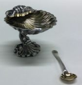 A good cast silver salt in the form of a shell on