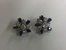 A pair of large sapphire and diamond cluster earri