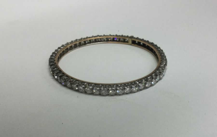 A good diamond fifty stone hinged bracelet with co