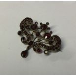 An Antique flat cut garnet brooch with matching dr