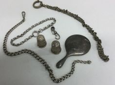 A collection of silver thimbles, chains, mirror et