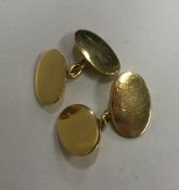 A pair of 9 carat oval gold cufflinks. Approx. 6 g