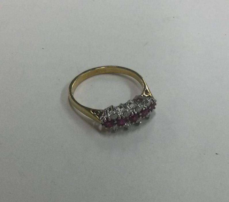 An attractive 18 carat twelve stone ring in claw s - Image 2 of 2