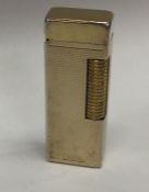 DUNHILL: A gold plated lighter of engine turned de