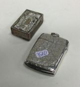 A large engraved silver vesta case together with a