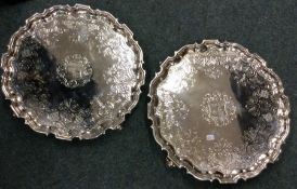 A rare pair of Georgian silver circular salvers wi