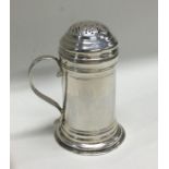 A good George II silver kitchen pepper on sweeping