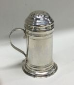 A good George II silver kitchen pepper on sweeping