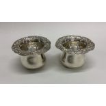 A pair of attractive cast silver bowls with floral