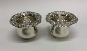 A pair of attractive cast silver bowls with floral