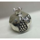 A heavy silver mounted model of a pomegranate with