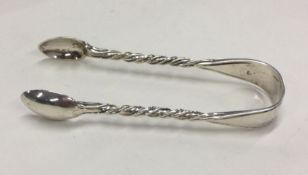 A pair of Edwardian silver sugar tongs with twiste