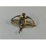 A stylish turquoise and gold brooch. Approx. 4 gra