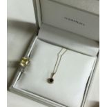 A heavy sapphire mounted pendant on gold chain tog