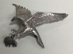 A large brooch in the form of an eagle with outstr