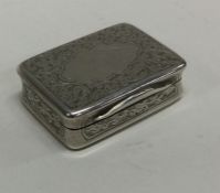 An engraved silver snuff box with vacant cartouche