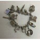 A fine link silver charm bracelet with heart shape