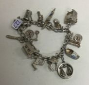 A fine link silver charm bracelet with heart shape