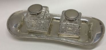 A heavy lady's silver two bottle inkstand with hin