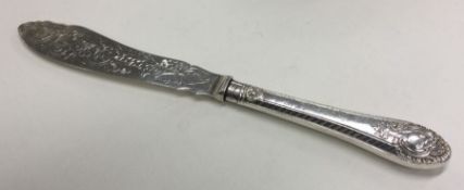A silver handled fish knife with engraved body. Sh