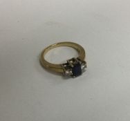 A 9 carat gold mounted sapphire and diamond thre