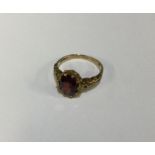 A 9 carat garnet single stone ring. Approx. 4 gram