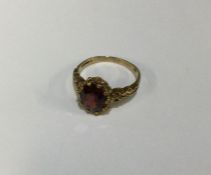 A 9 carat garnet single stone ring. Approx. 4 gram