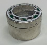 A silver and enamelled pill box with lift-off cove