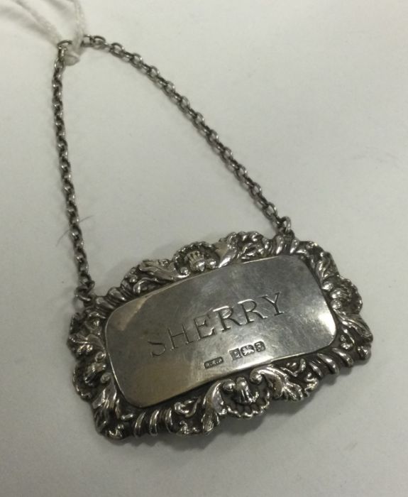 A heavy Edwardian silver wine label for 'Sherry'.