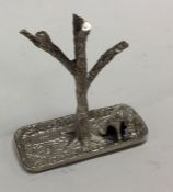 A novelty silver ring stand in the form of a tree