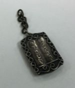 A Judaica silver charm mounted with 'The Ten Comma
