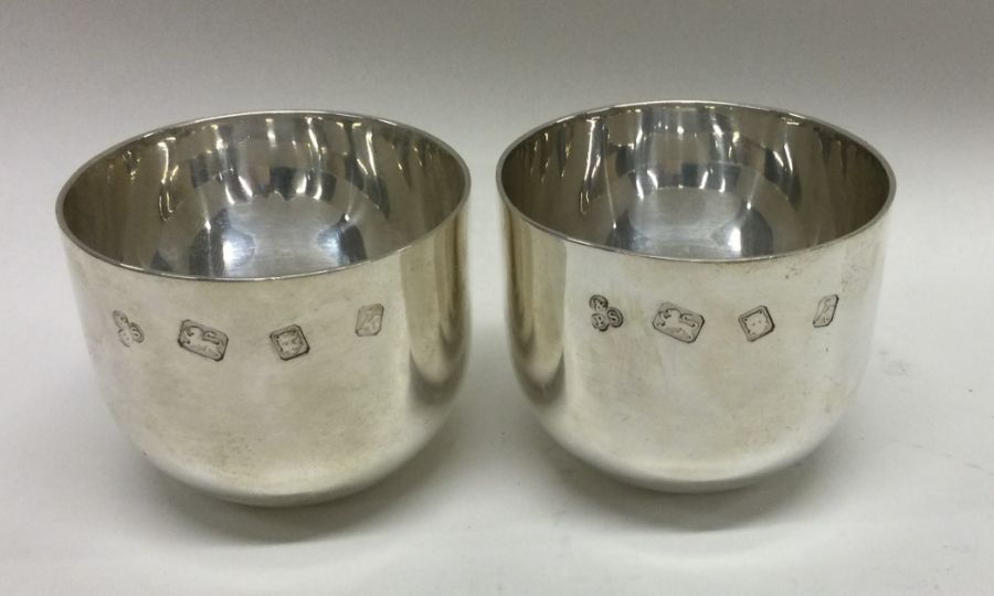 A good rare pair of heavy silver tumbler cups of p