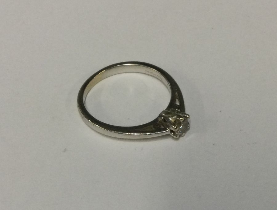 A good diamond single stone ring in 9 carat claw m