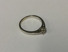 A good diamond single stone ring in 9 carat claw m