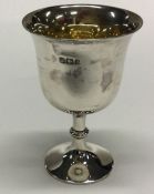 A heavy Edwardian silver spirit tot with gilt inte