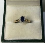 A 9 carat sapphire and diamond oval cluster ring i