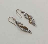 A pair of gold mounted earrings. Approx. 1 gram. E