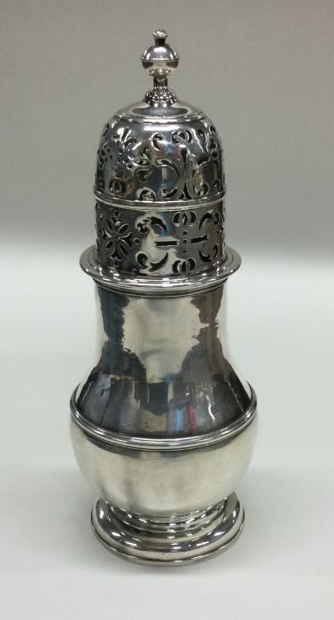 A large Georgian silver baluster shaped sugar cast