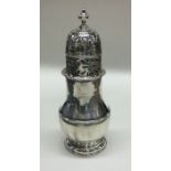 A large Georgian silver baluster shaped sugar cast