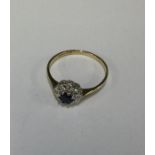A 9 carat sapphire and diamond circular cluster ri