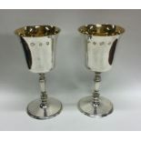 A heavy pair of tapering silver goblets with gilde