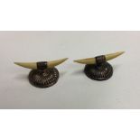 A heavy pair of silver half fluted knife rests. Sh