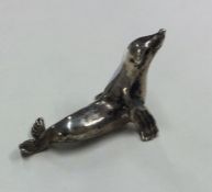 A novelty silver figure of a sea lion. Approx. 14