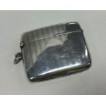 A heavy silver vesta case with engine turned decor