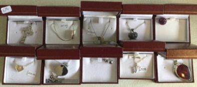 Ten cased silver pendants. Est. £25 - £30.