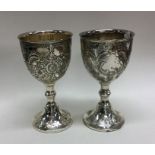 A good pair of chased silver plated goblets. Est.